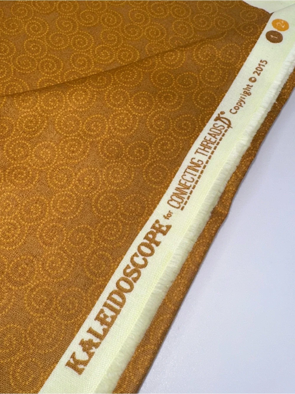 Kaleidoscope for Connecting Threads 2015 Swirl Design in Mustard